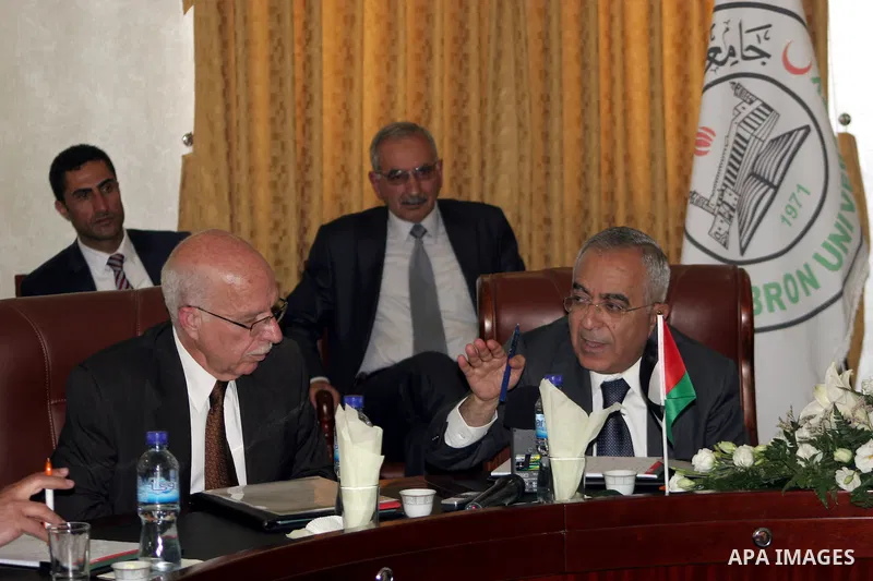 Palestinian prime minister Salam Fayyad attends the opening ceremony during the inauguration of Yasser Arafat Building at Hebron University in the Palestinian city of Hebron in the West Bank on May 30, 2011.Photo by Naje...