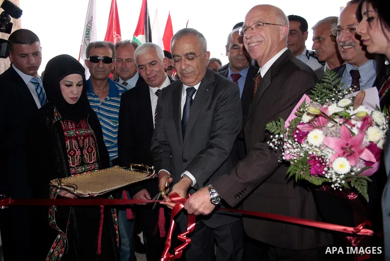Palestinian prime minister Salam Fayyad attends the opening ceremony during the inauguration of Yasser Arafat Building at Hebron University in the Palestinian city of Hebron in the West Bank on May 30, 2011.Photo by Naje...