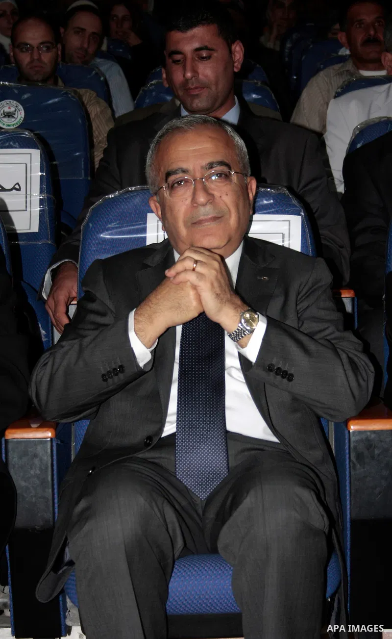 Palestinian prime minister Salam Fayyad attends the opening ceremony during the inauguration of Yasser Arafat Building at Hebron University in the Palestinian city of Hebron in the West Bank on May 30, 2011.Photo by Naje...