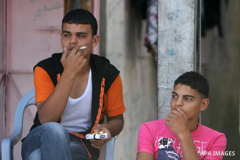 Palestinian man smokes cigarettes in Rafah, southern Gaza Strip on May 31, 2011. during the World No Tobacco Day, Middle East of some 240 million people soared 47 percent in the 1990s and has one of the highest smoking r...