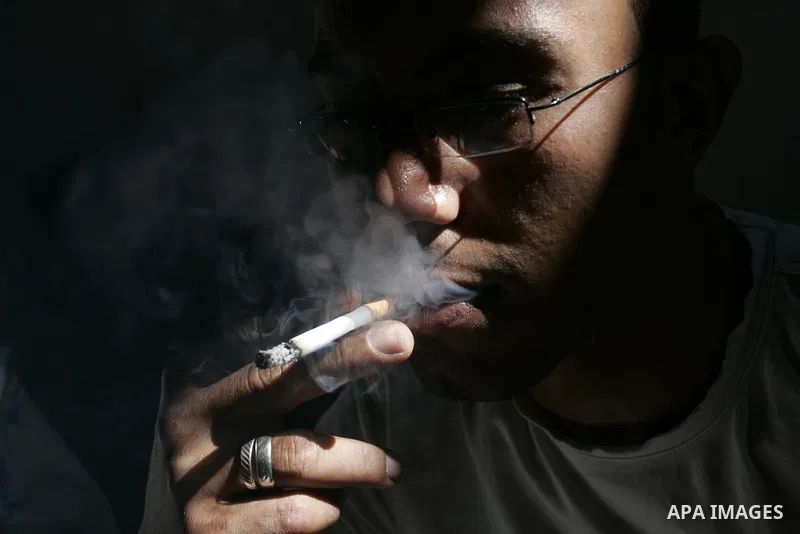 Palestinian man smokes cigarettes in Rafah, southern Gaza Strip on May 31, 2011. during the World No Tobacco Day, Middle East of some 240 million people soared 47 percent in the 1990s and has one of the highest smoking r...