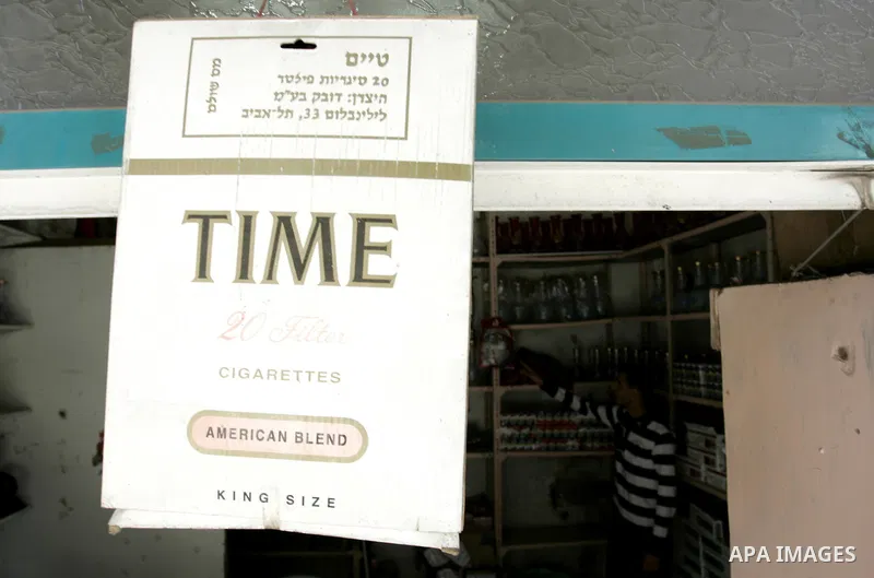 Palestinian man sells cigarettes in a shop in Rafah, southern Gaza Strip on May 31, 2011. during the World No Tobacco Day, Middle East of some 240 million people soared 47 percent in the 1990s and has one of the highest...