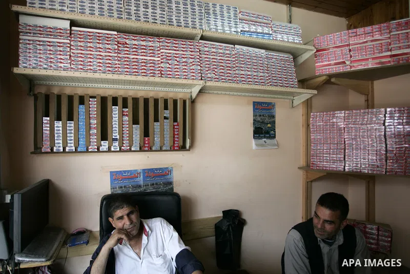 Palestinian man sells cigarettes in a shop in Rafah, southern Gaza Strip on May 31, 2011. during the World No Tobacco Day, Middle East of some 240 million people soared 47 percent in the 1990s and has one of the highest...