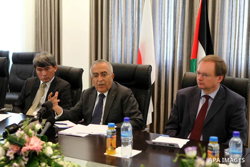 Palestinian Prime Minister Salam Fayyad during a joint press conference on May 31, 2011 in the west bank city of Ramallah, with the Representative of Japan, Naofumi Hashimoto and the EU Representative Christian Berger to...