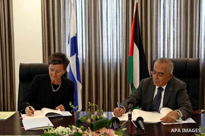Palestinian Prime Minister Salam Fayyad during signed financial agreement with Pia Rantala- Engberg Representative of Finland in the west bank city of Ramallah on May 31, 2011. Photo by Mustafa Abu Dayeh