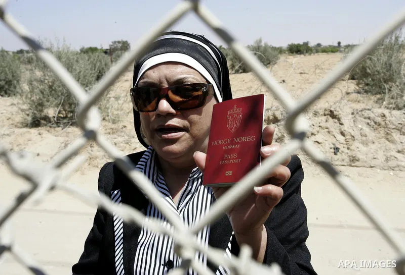 Palestinians wait to cross into Egypt through the Rafah border crossing in the southern Gaza Strip on June 1, 2011. Gaza's Hamas rulers said on Wednesday that Egypt limited the number of people allowed to enter from Gaza...
