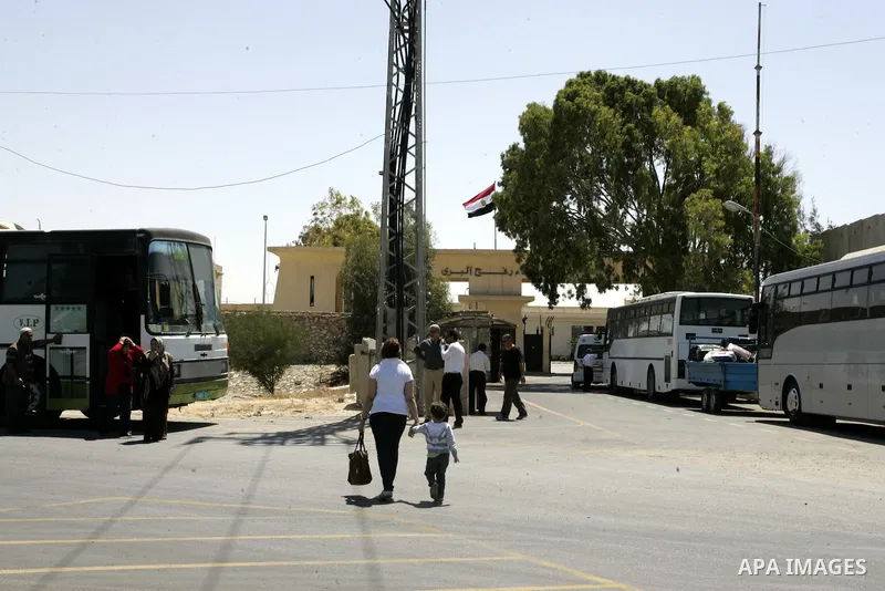 Palestinians wait to cross into Egypt through the Rafah border crossing in the southern Gaza Strip on June 1, 2011. Gaza's Hamas rulers said on Wednesday that Egypt limited the number of people allowed to enter from Gaza...