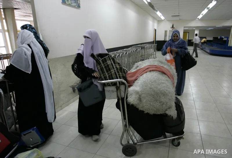 Palestinians wait to cross into Egypt through the Rafah border crossing in the southern Gaza Strip on June 1, 2011. Gaza's Hamas rulers said on Wednesday that Egypt limited the number of people allowed to enter from Gaza...