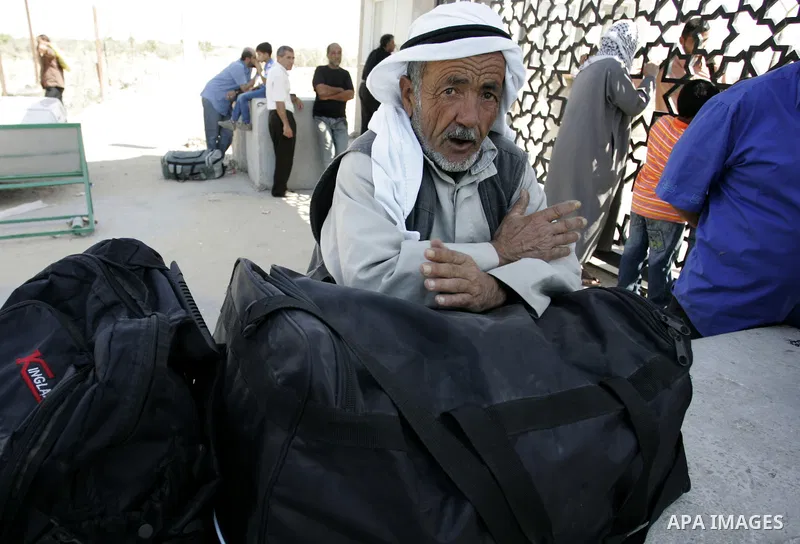 Palestinians wait to cross into Egypt through the Rafah border crossing in the southern Gaza Strip on June 1, 2011. Gaza's Hamas rulers said on Wednesday that Egypt limited the number of people allowed to enter from Gaza...