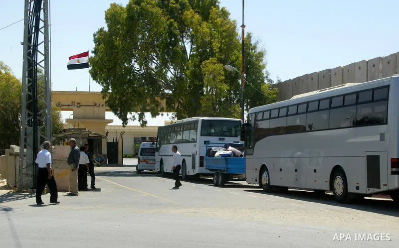 Palestinians wait to cross into Egypt through the Rafah border crossing in the southern Gaza Strip on June 1, 2011. Gaza's Hamas rulers said on Wednesday that Egypt limited the number of people allowed to enter from Gaza...