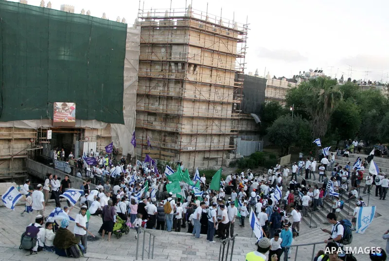 Israelis march at Damascus Gate, the main entrance to the old city of Jerusalem on June 1, 2011 as some 40,000 Jewish Israelis joined a Jerusalem Day parade in the city's mainly Arab eastern sector to celebrate its captu...