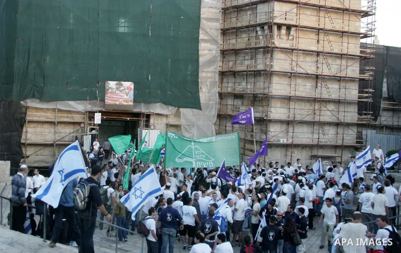 Israelis march at Damascus Gate, the main entrance to the old city of Jerusalem on June 1, 2011 as some 40,000 Jewish Israelis joined a Jerusalem Day parade in the city's mainly Arab eastern sector to celebrate its captu...