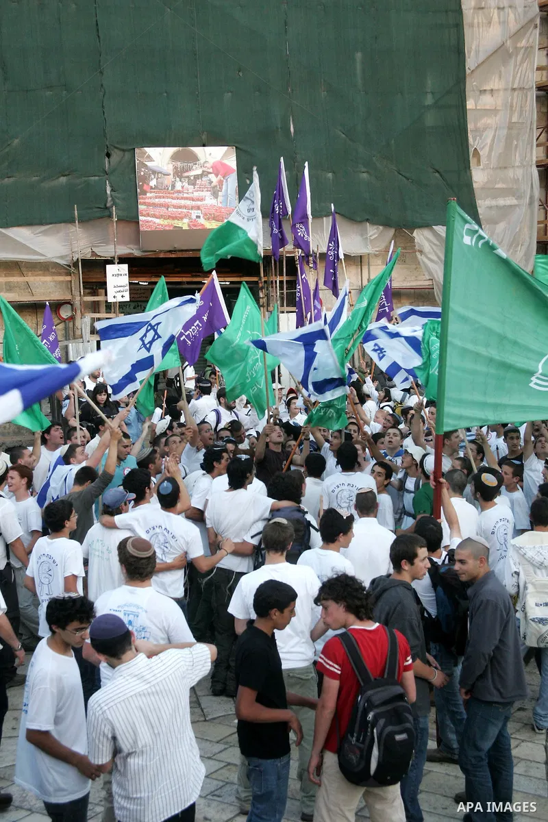 Israelis march at Damascus Gate, the main entrance to the old city of Jerusalem on June 1, 2011 as some 40,000 Jewish Israelis joined a Jerusalem Day parade in the city's mainly Arab eastern sector to celebrate its captu...