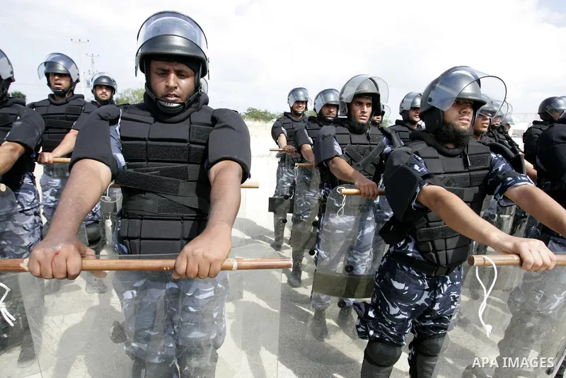 Palestinian Hamas security forces stand at attention during a graduation ceremony in the southern Gaza Strip town of Khan Yunis on 02 June 2011. The release of the captured soldier Versus for a thousand Palestinian priso...