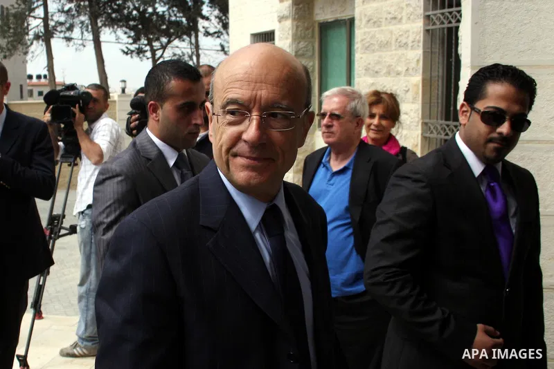 France's Foreign Minister, Alain Juppe during a visit in the West Bank city of Ramallah on June 2, 2011. Photo by Issam Rimawi
