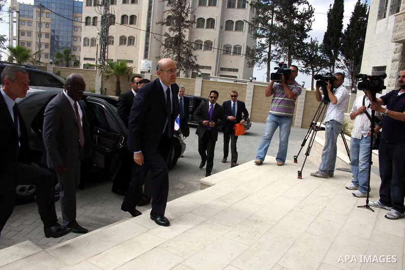 France's Foreign Minister, Alain Juppe during a visit in the West Bank city of Ramallah on June 2, 2011. Photo by Issam Rimawi
