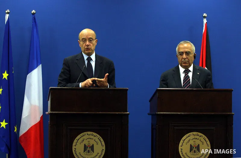 Palestinian Prime Minister, Salam Fayyad and France's Foreign Minister, Alain Juppe during a press conference in the West Bank city of Ramallah on June 2, 2011. as Juppe announced France is ready to host a Middle East pe...