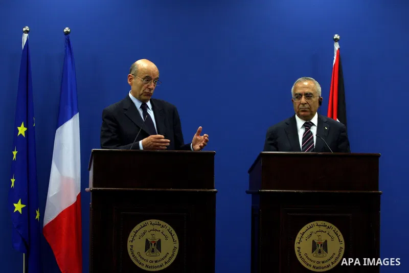 Palestinian Prime Minister, Salam Fayyad and France's Foreign Minister, Alain Juppe during a press conference in the West Bank city of Ramallah on June 2, 2011. as Juppe announced France is ready to host a Middle East pe...