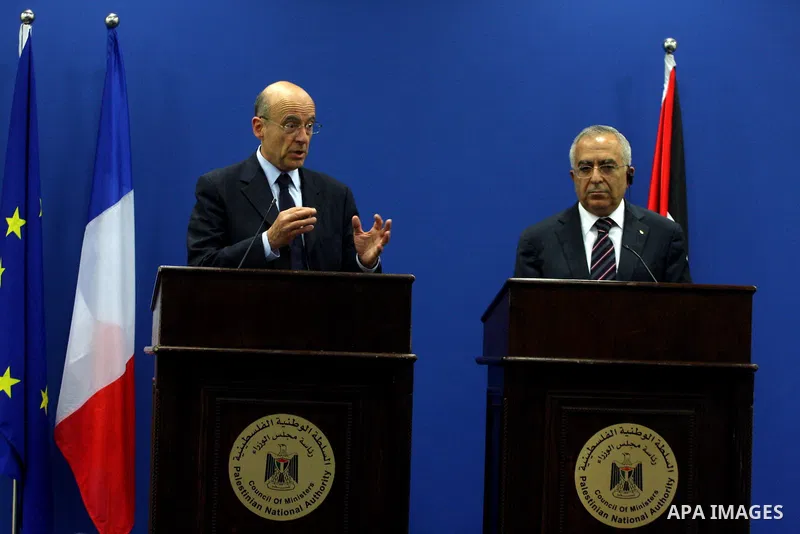 Palestinian Prime Minister, Salam Fayyad and France's Foreign Minister, Alain Juppe during a press conference in the West Bank city of Ramallah on June 2, 2011. as Juppe announced France is ready to host a Middle East pe...