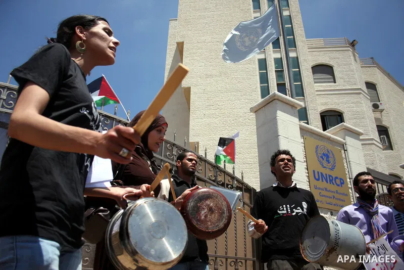 Palestinians protest in front of the UN headquarters in the West Bank city of Ramallah against UN chief Ban Ki-moon's call "on all governments" in the region to use to their influence to push against a new flotilla of sh...