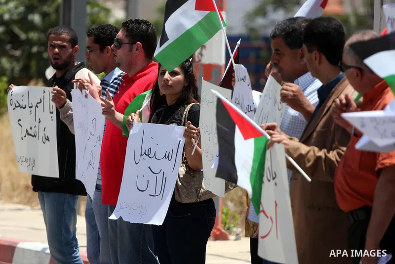 Palestinians protest in front of the UN headquarters in the West Bank city of Ramallah against UN chief Ban Ki-moon's call "on all governments" in the region to use to their influence to push against a new flotilla of sh...