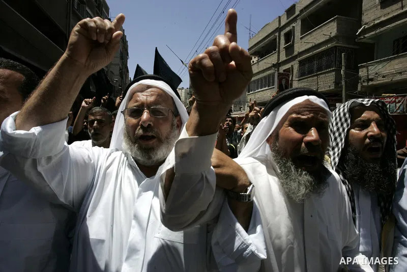 Palestinian Islamic Jihad supporters shout slogans as they march in the Khan Yunis refugee camp in the southern Gaza Strip on June 03, 2011 to mark the 44th anniversary of Six Day War and the annexation of east Jerusalem...