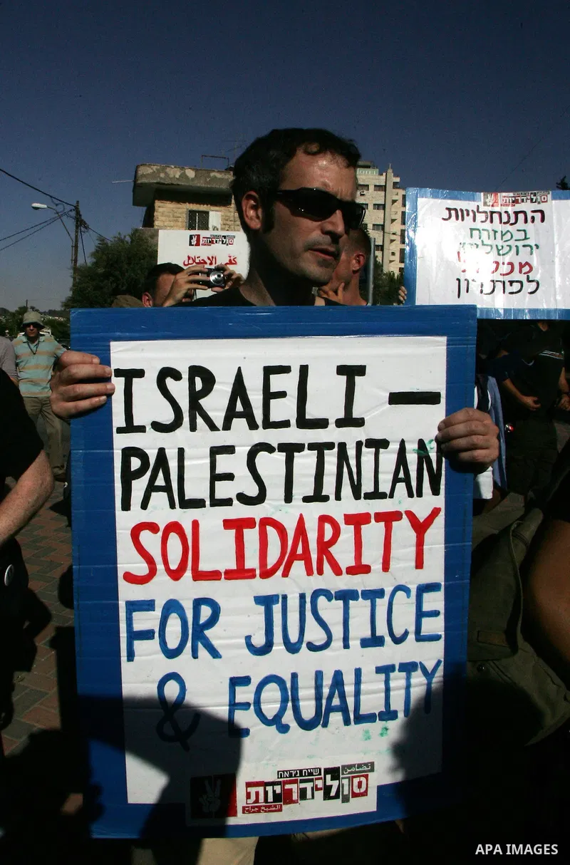 Palestinians, Israelis and foreign activists take part in the weekly demonstration in the neighborhood of Sheikh Jarrah in East Jerusalem on June 3, 2011. Photo by Mahfouz Abu Turk
