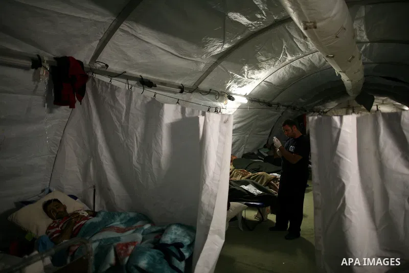 Wounded Libyan rebels were put under medical surveillance at a temporary Intensive Care Unit set up on a ship evacuating injured residents and stranded foreign refugees from the city of Misrata to Benghazi, in the Medite...