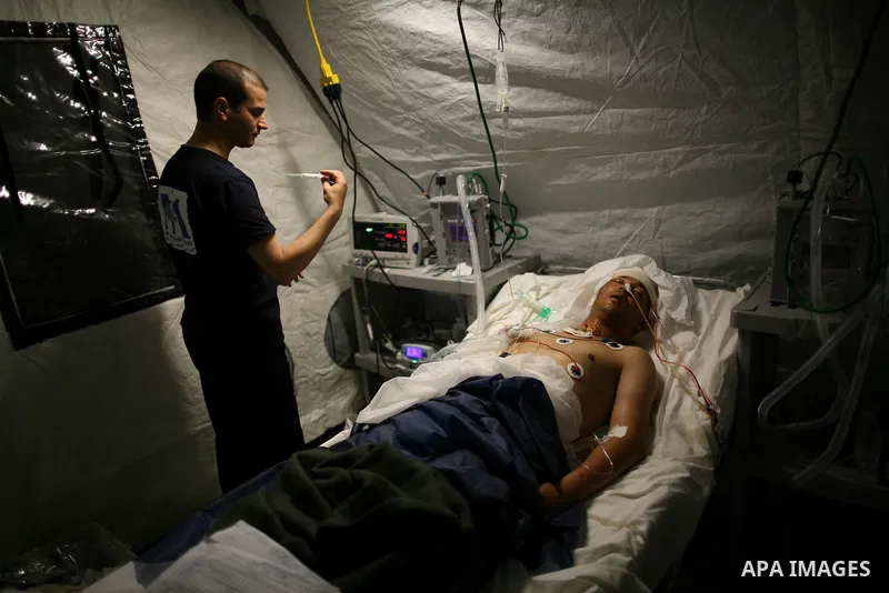 Wounded Libyan rebels were put under medical surveillance at a temporary Intensive Care Unit set up on a ship evacuating injured residents and stranded foreign refugees from the city of Misrata to Benghazi, in the Medite...