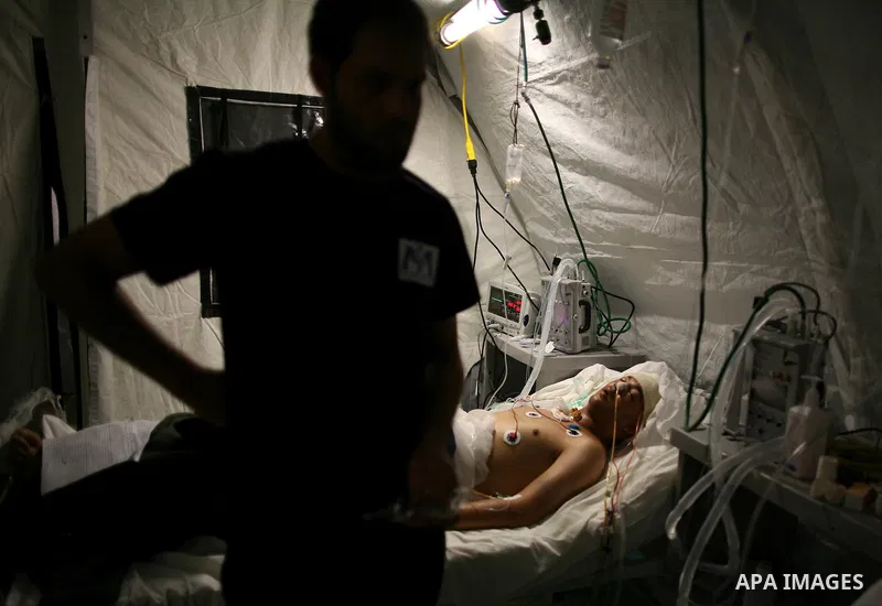 Wounded Libyan rebels were put under medical surveillance at a temporary Intensive Care Unit set up on a ship evacuating injured residents and stranded foreign refugees from the city of Misrata to Benghazi, in the Medite...