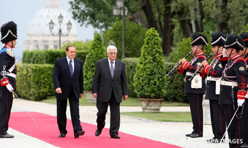 Palestinian President Mahmoud Abbas and Italy's Prime Minister Silvio Berlusconi review an honour guard during a meeting on June 3, 2011 at Villa Pamphili in Rome. Photo by Thaer Ganaim