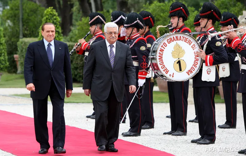 Palestinian President Mahmoud Abbas and Italy's Prime Minister Silvio Berlusconi review an honour guard during a meeting on June 3, 2011 at Villa Pamphili in Rome. Photo by Thaer Ganaim