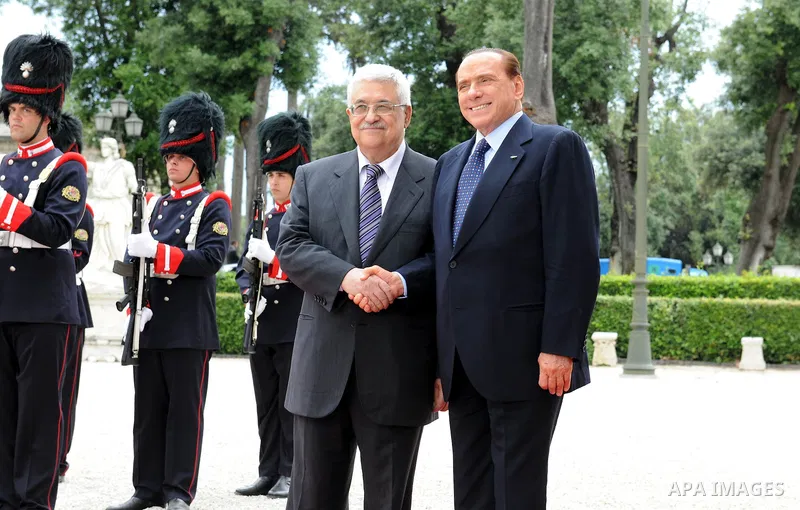 Palestinian President Mahmoud Abbas shakes hands with Italy's Prime Minister Silvio Berlusconi during a meeting on June 3, 2011 at Villa Pamphili in Rome. Photo by Thaer Ganaim