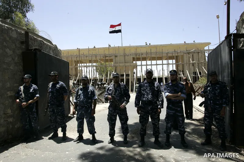 Hamas policemen stand in front of Egyptian soldiers as they prevent Palestinians from coming close to the iron gate of a border crossing with Egypt in the southern Gaza strip June 4, 2011. Egyptian officials at the borde...