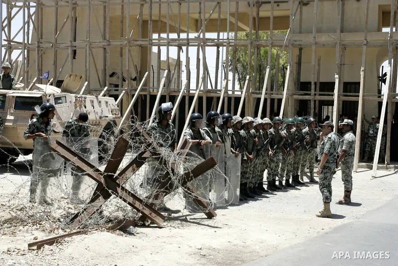 Egyptian soldiers stand guard as they prevent Palestinians crossing the border with Egypt in the southern Gaza strip on June 4, 2011. Egyptian officials at the border with Gaza barred Palestinians from crossing, but late...