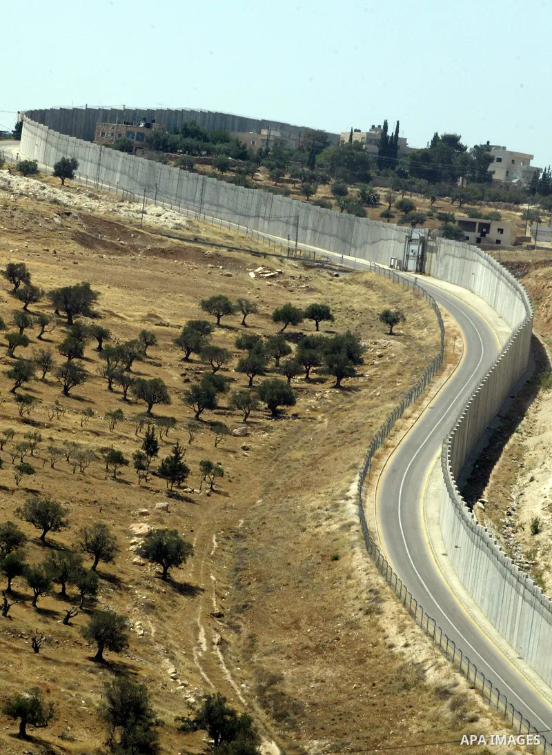 A view for a part of Israel's controversial separation barrier in the West Bank town of Abu Dis on June 4,2011. Israel says the projected 723 kilometres (454 miles) of steel and concrete walls, fences and barbed wire are...