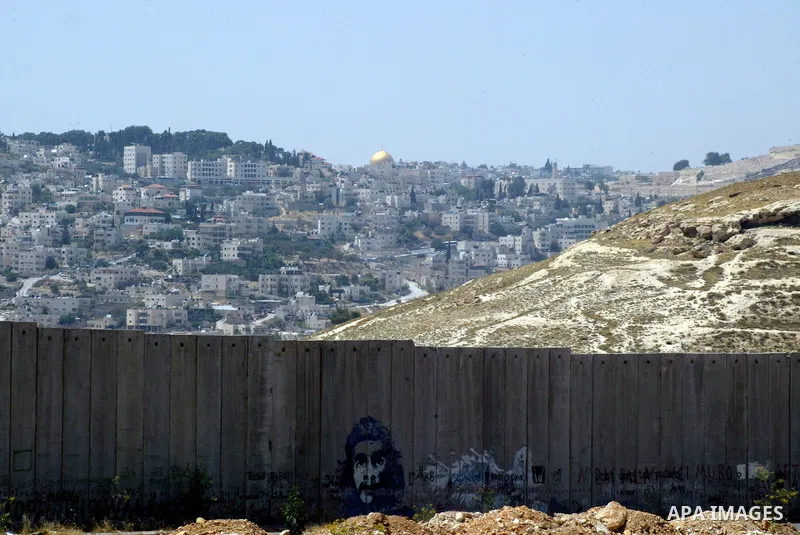 A view for a part of Israel's controversial separation barrier in the West Bank town of Abu Dis on June 4,2011. Israel says the projected 723 kilometres (454 miles) of steel and concrete walls, fences and barbed wire are...