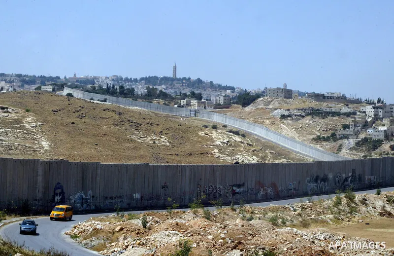A view for a part of Israel's controversial separation barrier in the West Bank town of Abu Dis on June 4,2011. Israel says the projected 723 kilometres (454 miles) of steel and concrete walls, fences and barbed wire are...