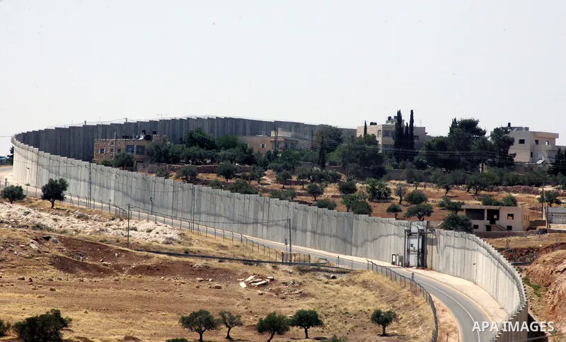 A view for a part of Israel's controversial separation barrier in the West Bank town of Abu Dis on June 4,2011. Israel says the projected 723 kilometres (454 miles) of steel and concrete walls, fences and barbed wire are...
