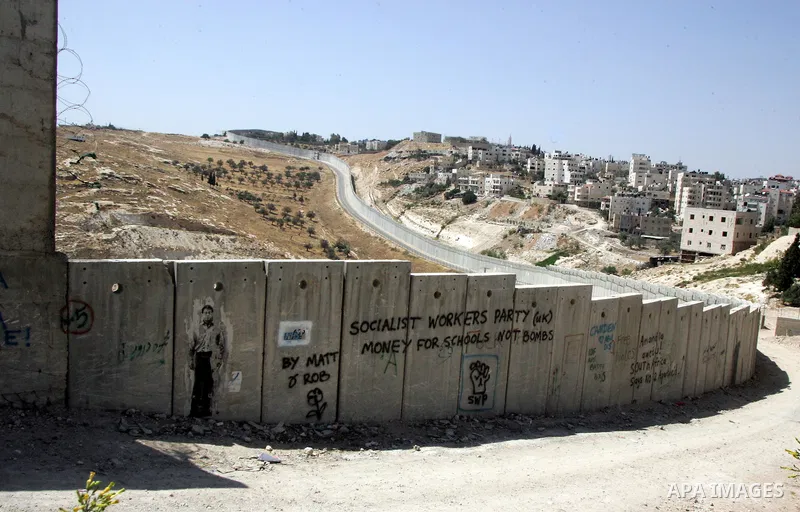 A view for a part of Israel's controversial separation barrier in the West Bank town of Abu Dis on June 4,2011. Israel says the projected 723 kilometres (454 miles) of steel and concrete walls, fences and barbed wire are...