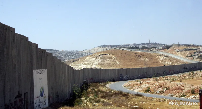 A view for a part of Israel's controversial separation barrier in the West Bank town of Abu Dis on June 4,2011. Israel says the projected 723 kilometres (454 miles) of steel and concrete walls, fences and barbed wire are...