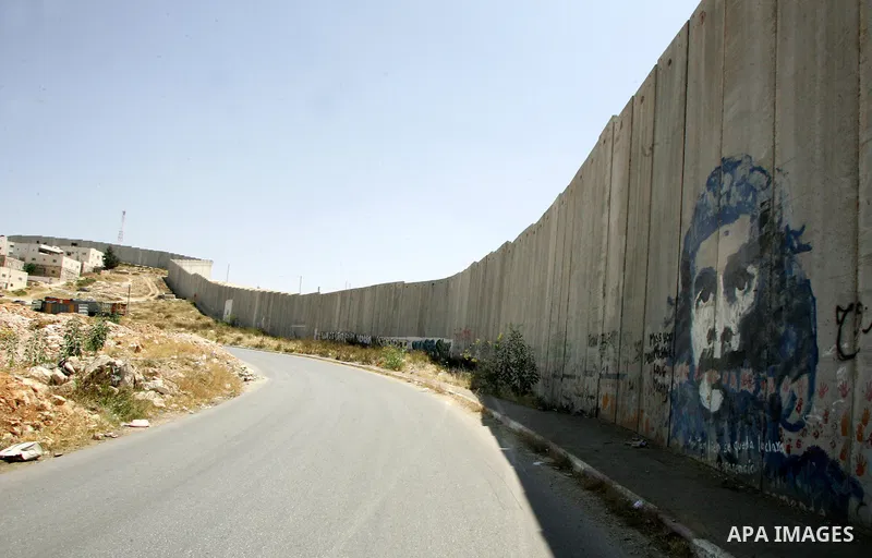A view for a part of Israel's controversial separation barrier in the West Bank town of Abu Dis on June 4,2011. Israel says the projected 723 kilometres (454 miles) of steel and concrete walls, fences and barbed wire are...