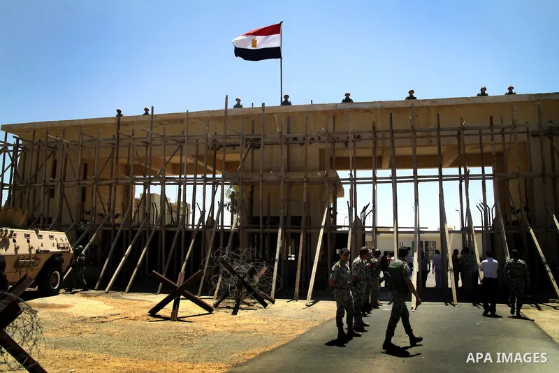 Egyptian soldiers help Palestinian passengers at the Rafah border crossing in the southern Gaza Strip 04 June 2011. Egyptian authorities reopened its Rafah border crossing with the Gaza Strip after a temporary closure wh...