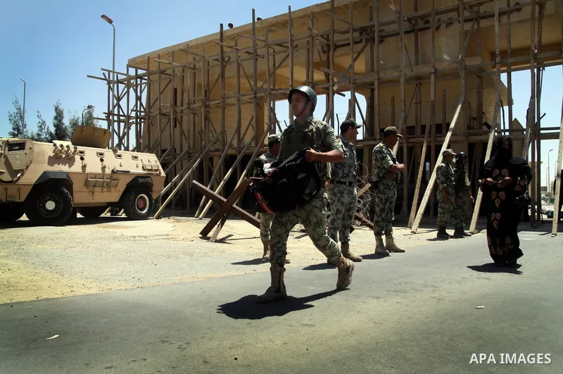 Egyptian soldiers help Palestinian passengers at the Rafah border crossing in the southern Gaza Strip 04 June 2011. Egyptian authorities reopened its Rafah border crossing with the Gaza Strip after a temporary closure wh...