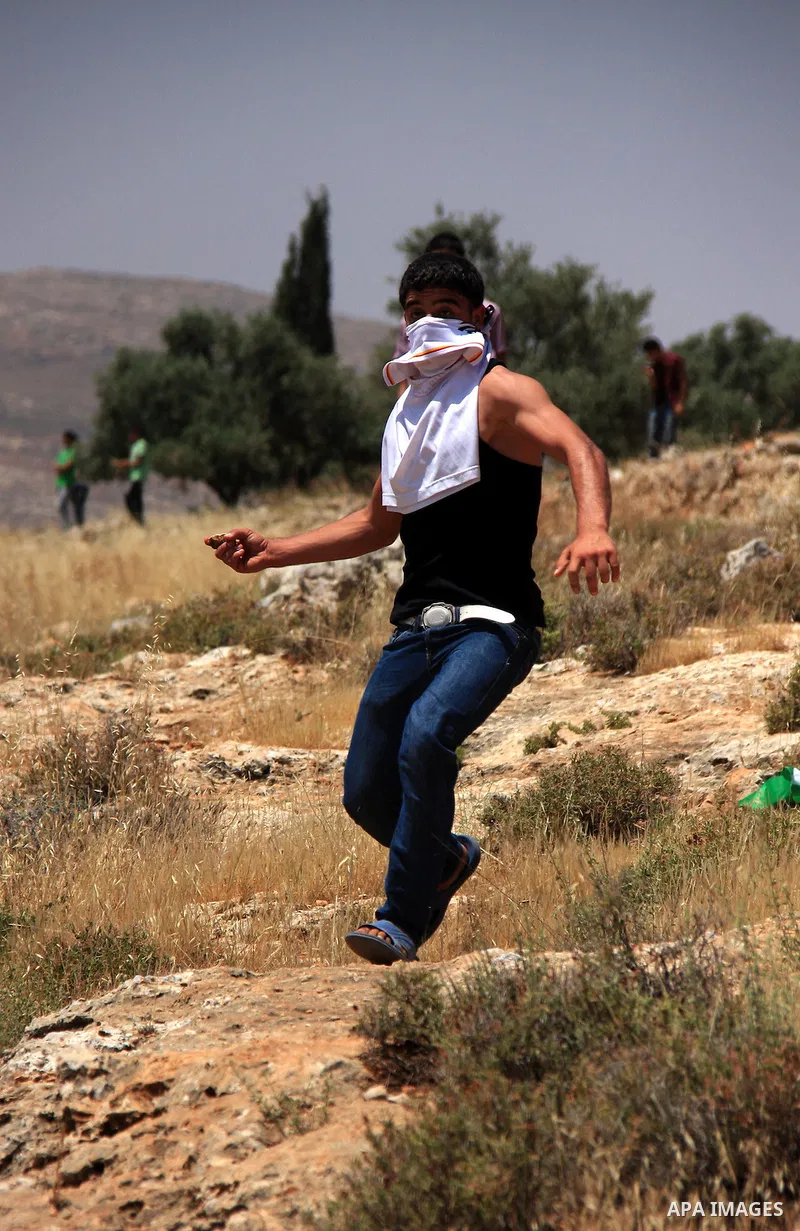 Palestinian protestors clash with Israeli forces following a demonstration against Israeli settlements in the West Bank village of Dair al-Hatab, east of Nablus, on June 5, 2011 as Israeli security forces go on high aler...