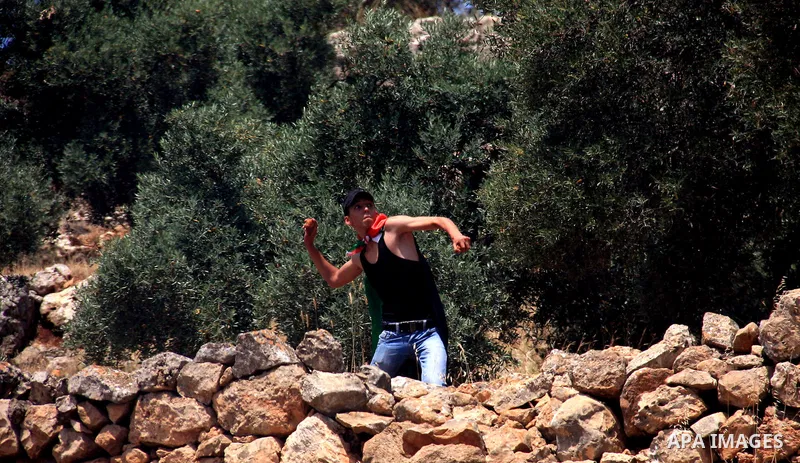 Palestinian protestors clash with Israeli forces following a demonstration against Israeli settlements in the West Bank village of Dair al-Hatab, east of Nablus, on June 5, 2011 as Israeli security forces go on high aler...