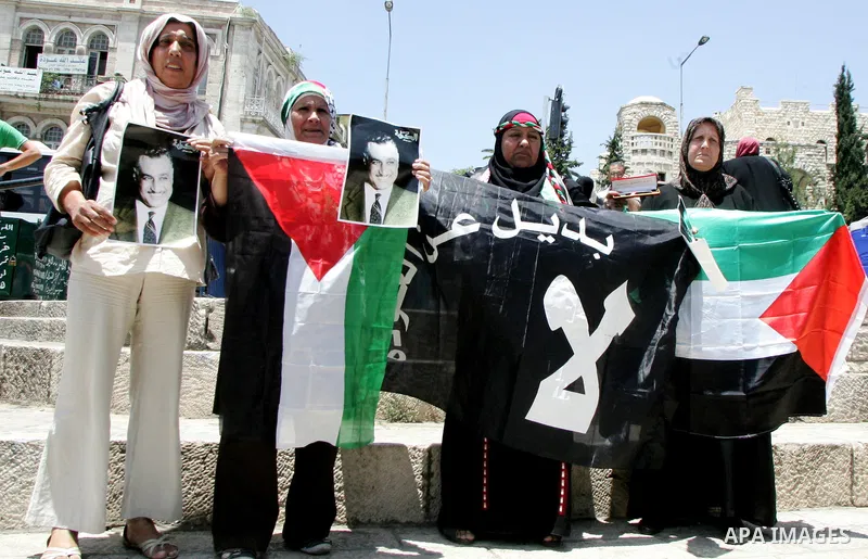 Palestinians take part in a protest at Damascus Gate, the main entrance to the old city of Jerusalem, on June 5, 2011 as Israeli security forces go on high alert while Palestinian activists in Jerusalem, the West Bank, G...
