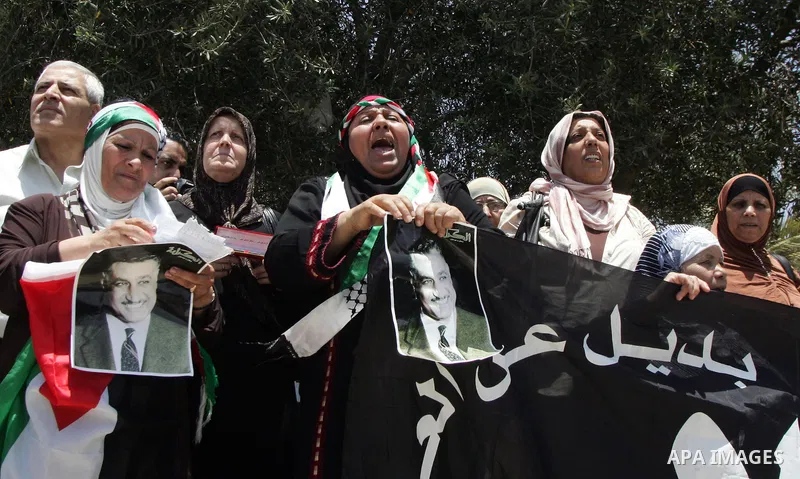 Palestinians take part in a protest at Damascus Gate, the main entrance to the old city of Jerusalem, on June 5, 2011 as Israeli security forces go on high alert while Palestinian activists in Jerusalem, the West Bank, G...