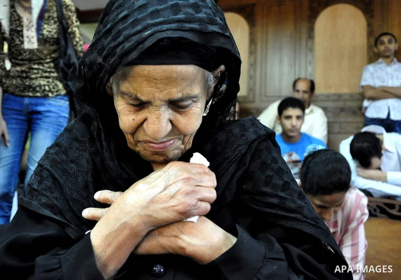 Egyptian Coptic Christians attend Sunday mass at the Virgin Mary church in the Imbaba district of the Egyptian capital of Cairo on June 5, 2011 following the church's restoration after it was burnt during clashes between...