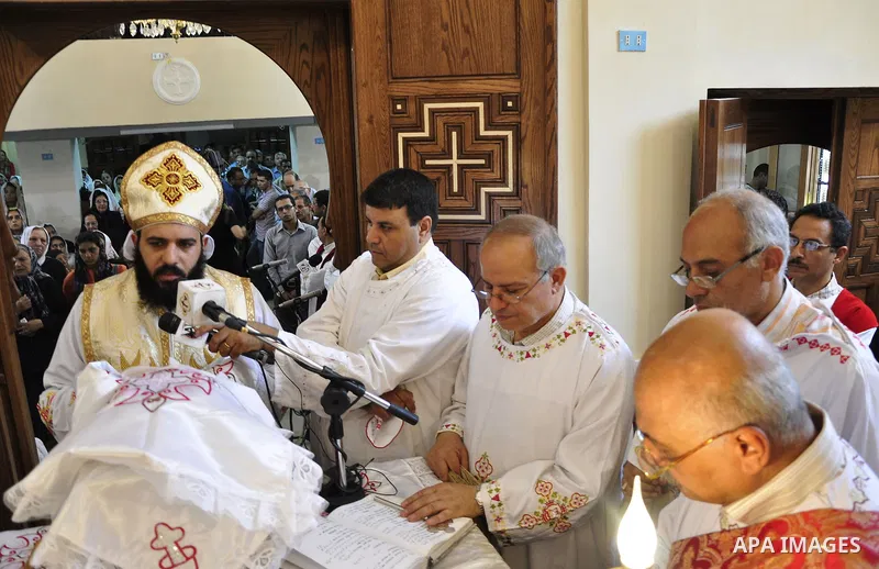 Egyptian Coptic Christian clerics lead Sunday mass at the Virgin Mary church in the Imbaba district of the Egyptian capital of Cairo on June 5, 2011 following the church's restoration after it was burnt during clashes be...